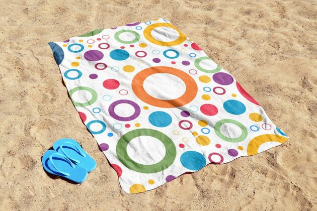 free-beach-towel-on-beach-sand-realistic-towel-online-mockup-generator-psd-template-2-