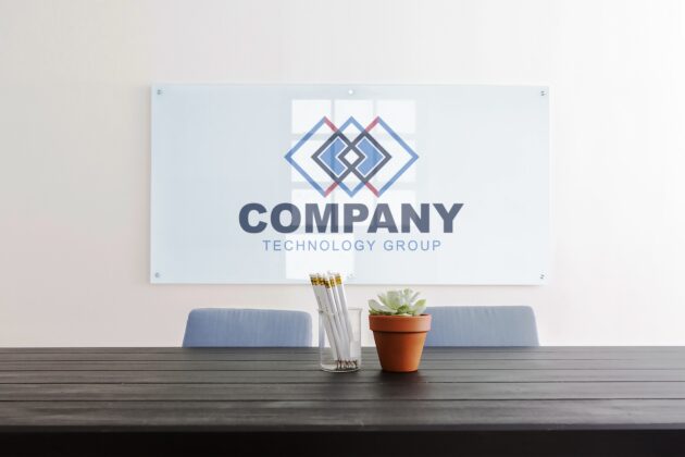 company-glass-sign-logo-over-business-desk-board-room-meeting-desk