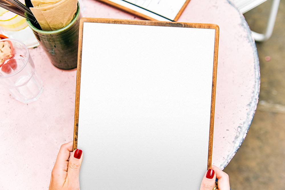 004-woman-holding-menu-mockup-template-psd