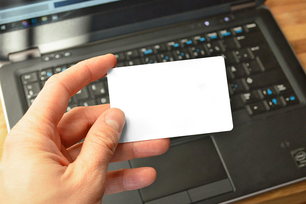 16-man-holding-credit-card-laptop-online-payment