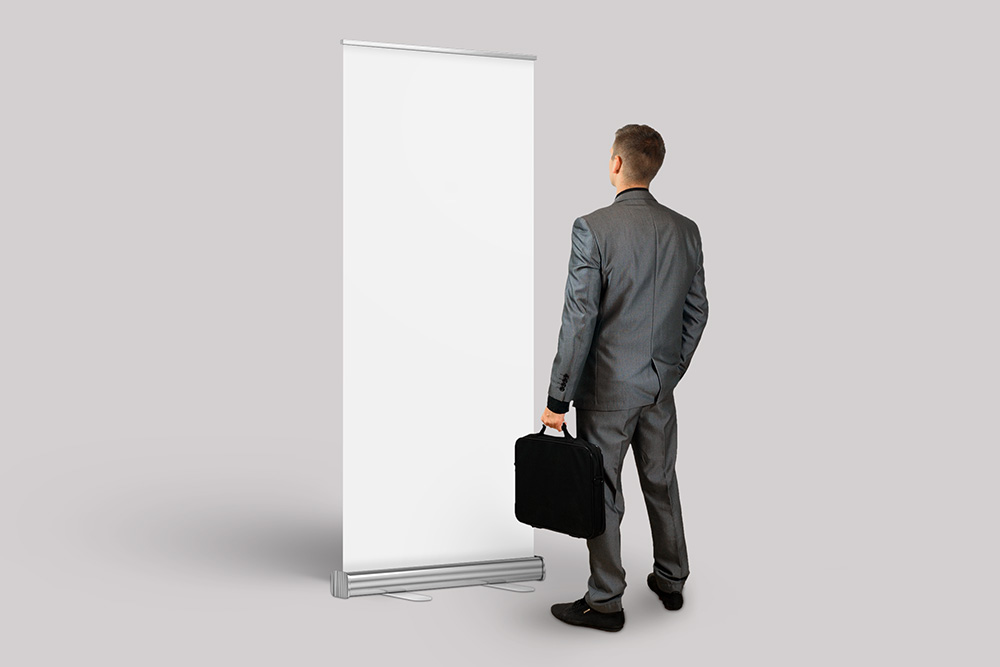 18-exhibition-booth-rollup-mockup-with-business-man